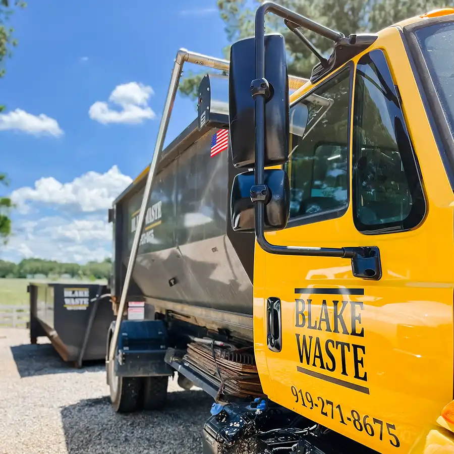 Blake waste truck dropping off rolesville dumpster rental